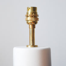 Load image into Gallery viewer, close up of brass fitting on a white lamp base
