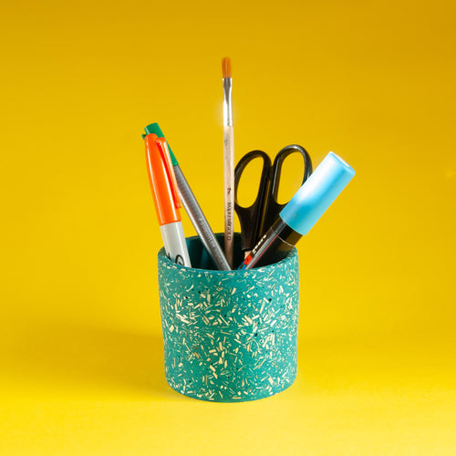 Teal pot with pens